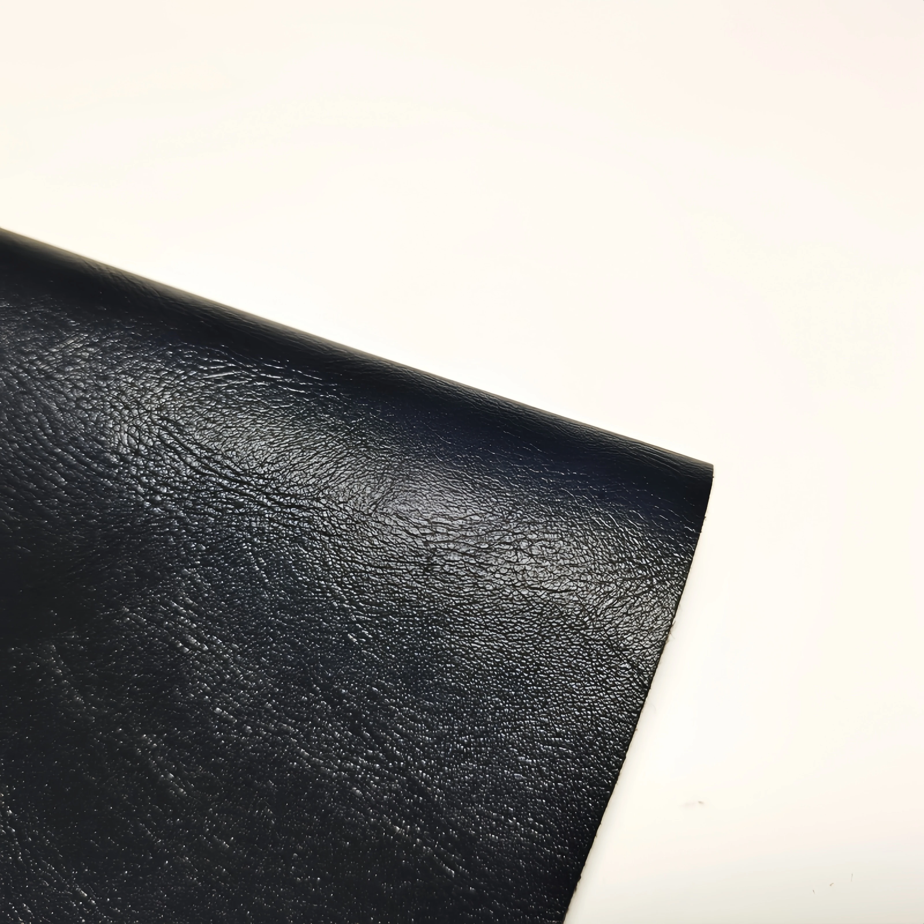Black 0.9MM thick high-quality smooth fine sheepskin pattern PU synthetic leather fabric used for handbag, car seat material