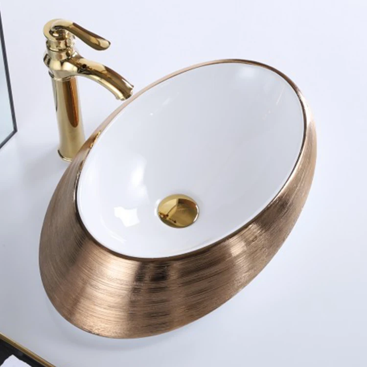 hot sale home modern brushed gold oval ceramic above countertop sink bathroom hand wash basin