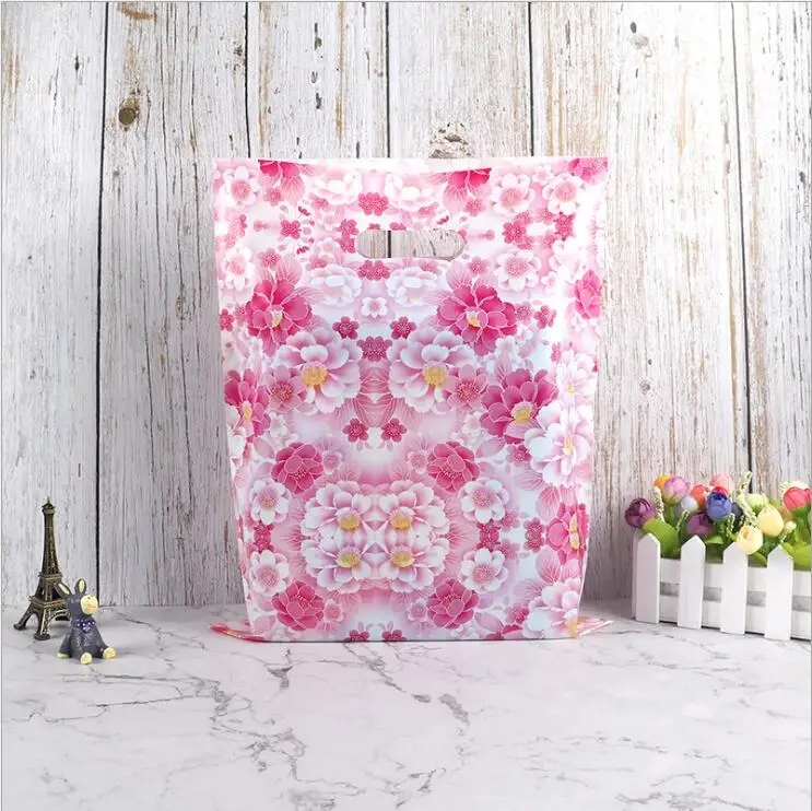 Индивидуальные пластиковые пакеты с напечатанным собственным логотипом биоразлагаемые розовая вырезанная ручка