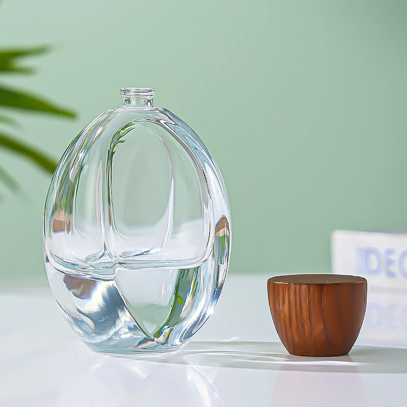 Luxury Custom Transparent Oval Perfume Bottle 50ML Thick Bottom Cologne Water Bottle Wooden Cover Perfume Spray
