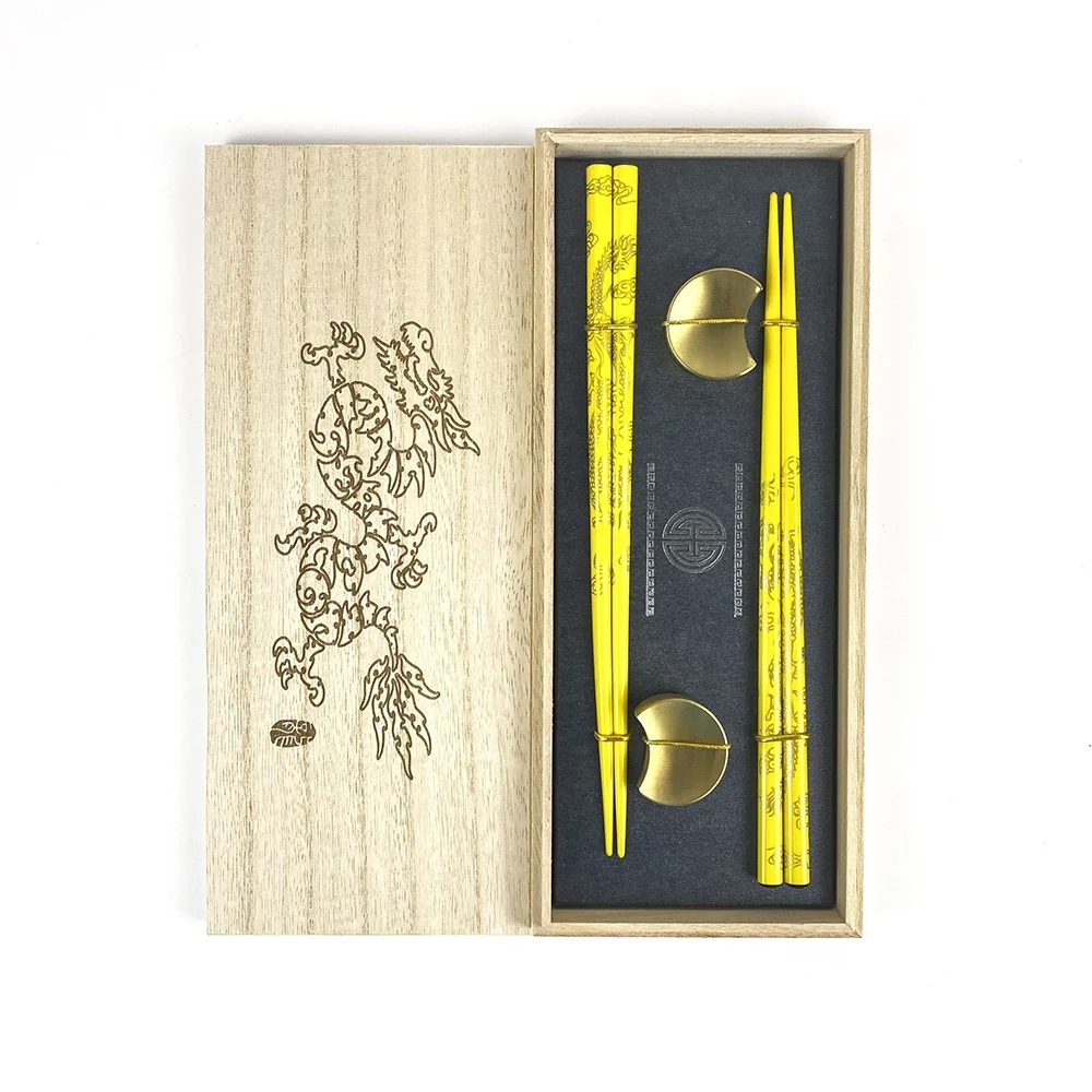high-end golden dragon wood chopsticks with elegant golden moon stainless steel holders for restaurant