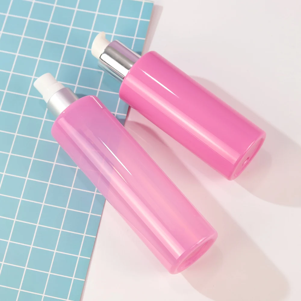Customized Cosmetic Packaging Pink Lotion Bottle 150ml PET Cylinder Plastic Bottle With Pump Sprayer