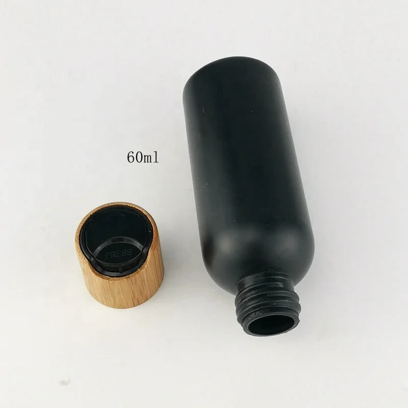 60 ml matte black bottles 2 ounce plastic HDPE bottle with bamboo closures for cosmetic packaging