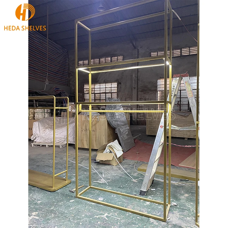 Heda Retail Store Fixtures Hanging Clothes Custom Shop Design Metal Gold Clothing Dress Display Rack