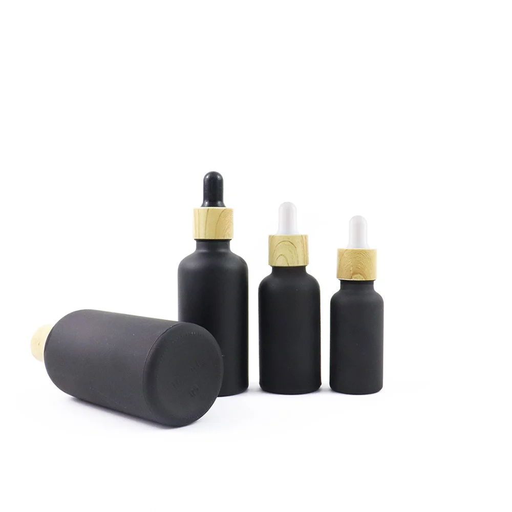 Wholesale 5mL 10mL 15mL 20mL 30mL 50mL 100mL Matte Frosted Black Dropper Bottles With Bamboo Cap Calibrated Glass Pipette