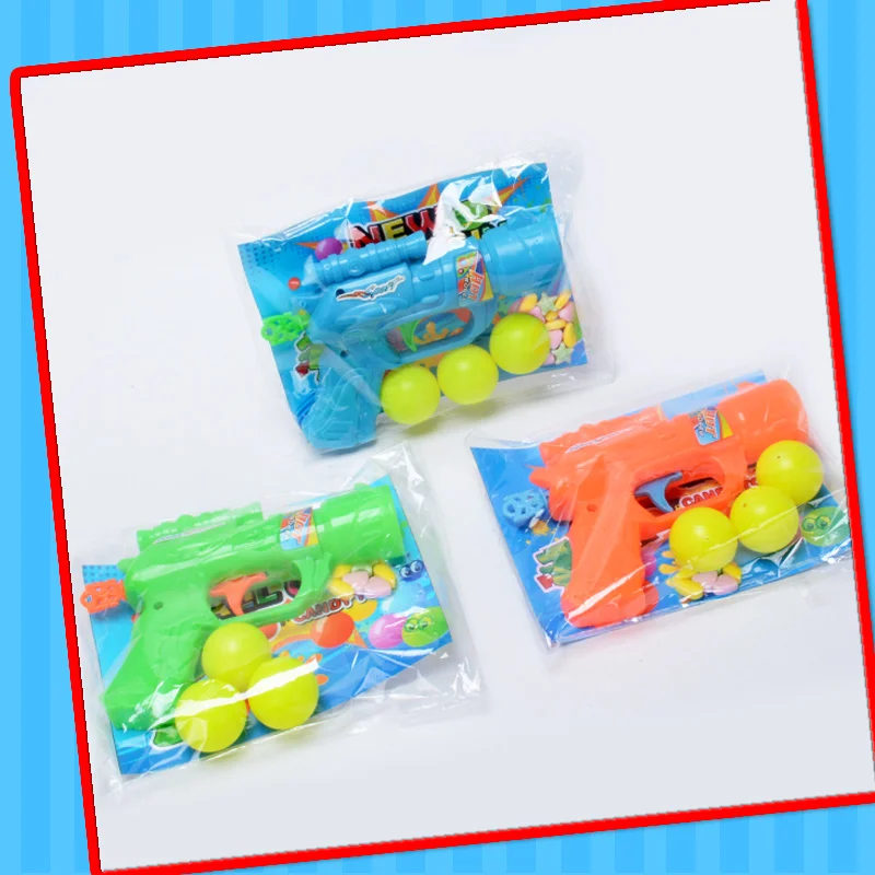 2022 cheap toy of plastic gun toy with candy best selling in supermarket shooting pingpong gun orange green color