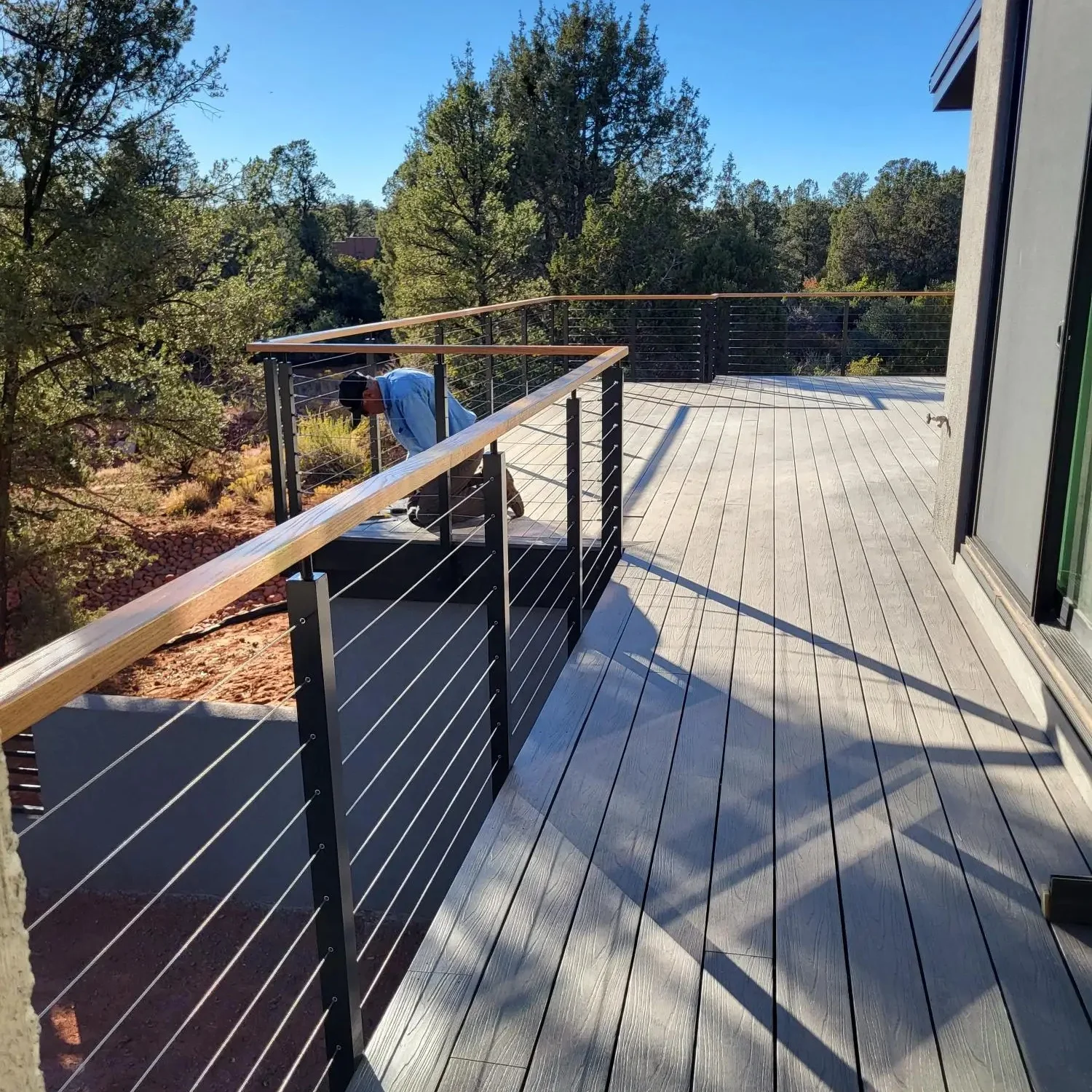 Black aluminum cable railing post with wooden handrail cable railing design