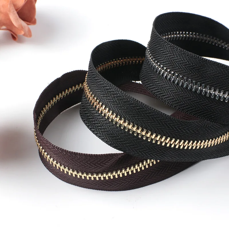 jinhua yiwu metal titanium aluminum alloy zips cremalleras zipper per meter zippers tape by the yard for jacket jeans