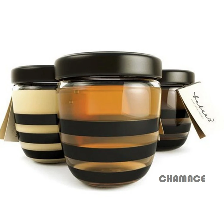 Wholesale clear round bee shaped storage bottles empty honey jars honey glass jar with plastic lid