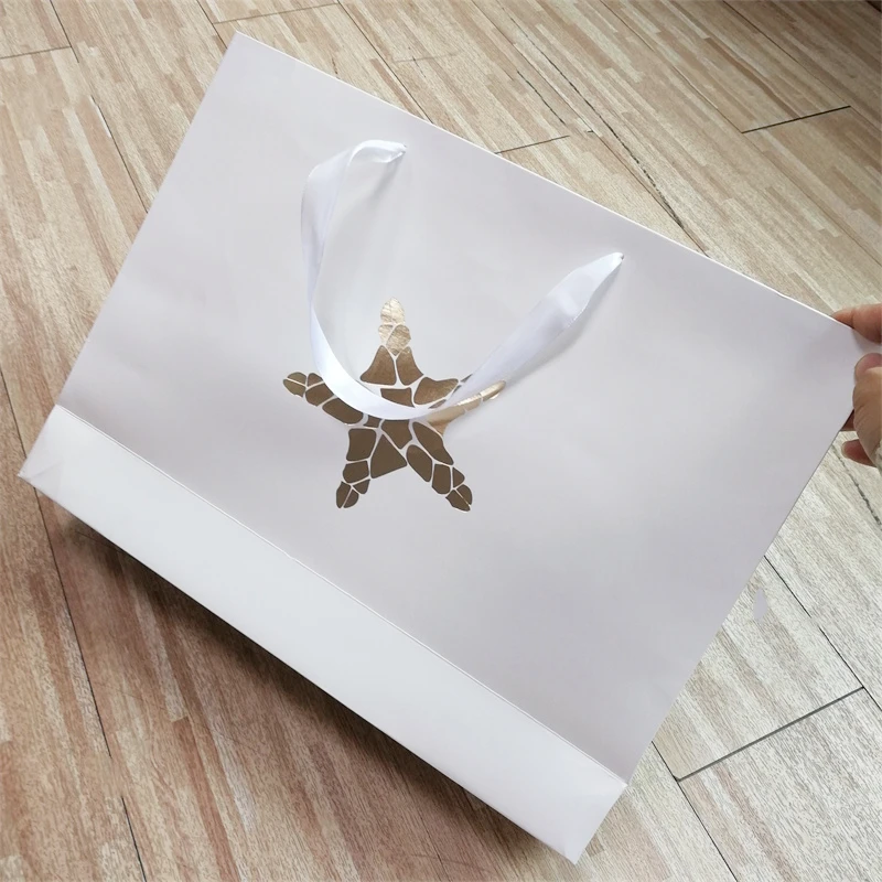 Custom White Craft Paper Bag With Logo Print Wholesale Packing Shipping Paper Bags Ribbon Handle Paper Tag For Clothes Store
