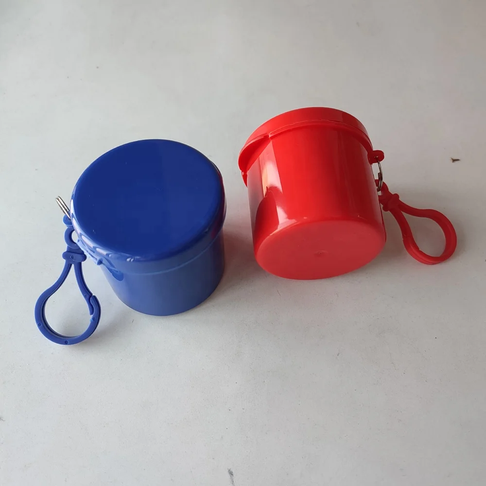 
disposable raincoat in a plastic round box 