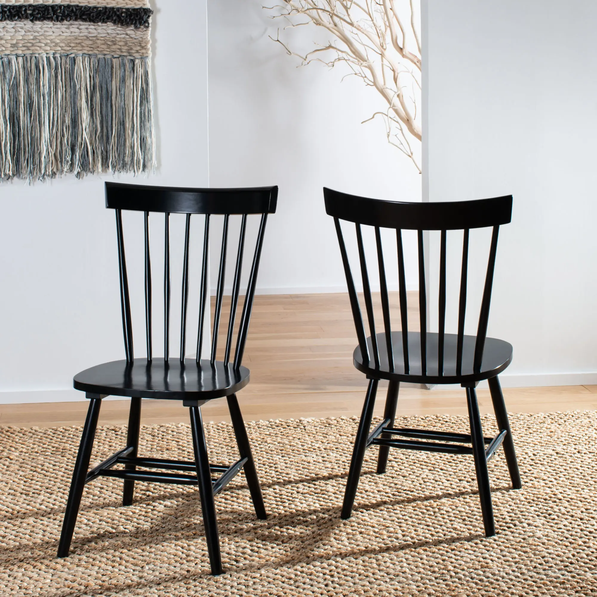 Malaysian oak in smooth black tones is used to make the dining chair modern and simple