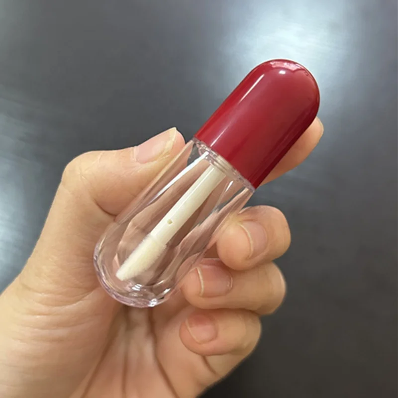 Hot sale pill shaped mini cute lipgloss tubes pink red custom logo empty lip gloss containers clear bottle with brush 4ml