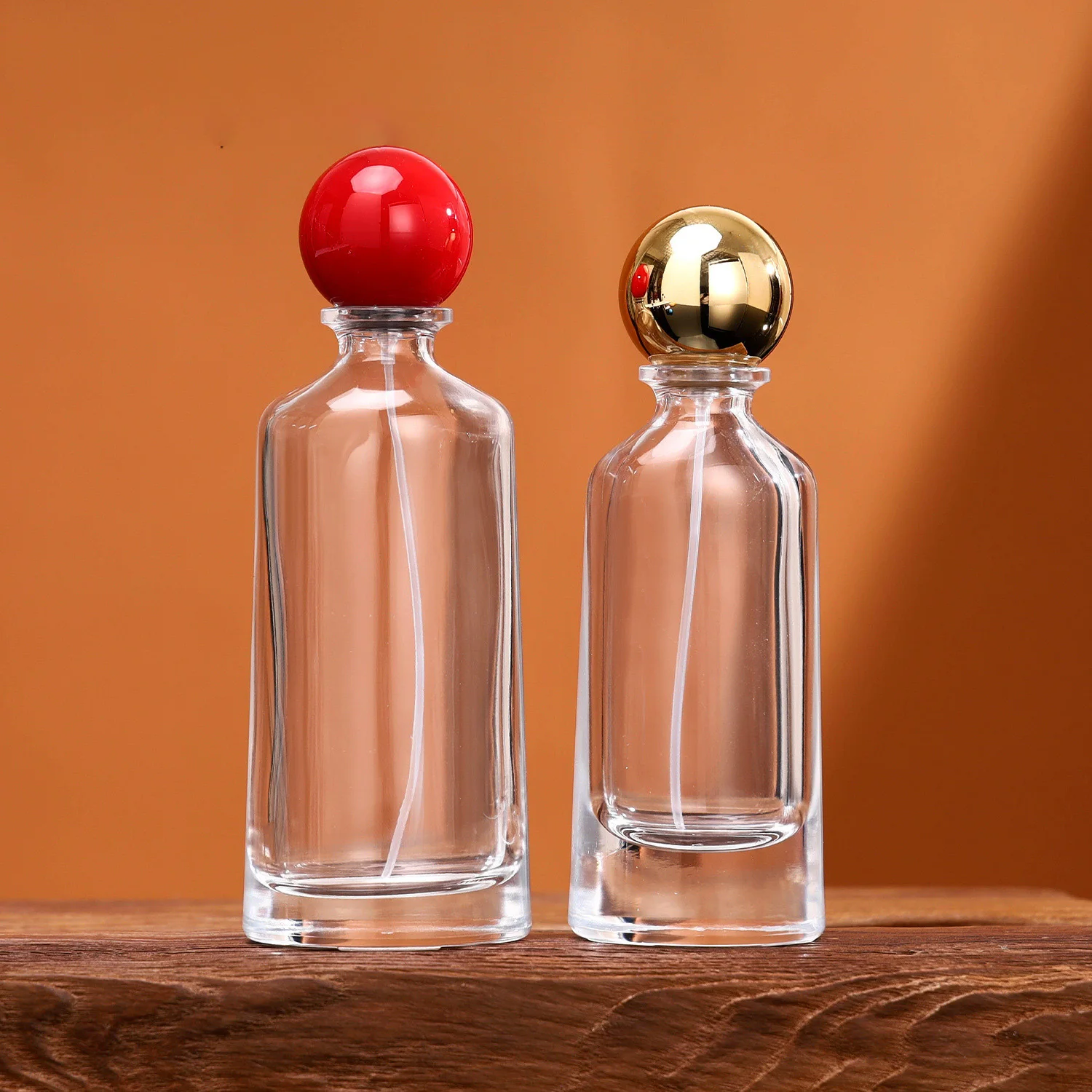 New Style 50ml Thick Bottom Shaped Perfume Bottle 100ml Clear Irregular Perfume Atomizer with Round Ball Lids
