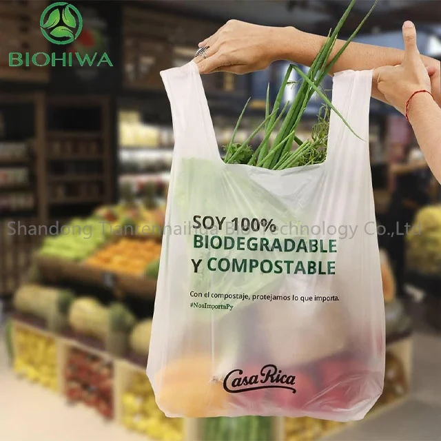 Order 1 tons Compostable T Shirt Bag Biodegradable Shopping Carry Out bag On Roll PLA PBAT Star Seal Cheap Price