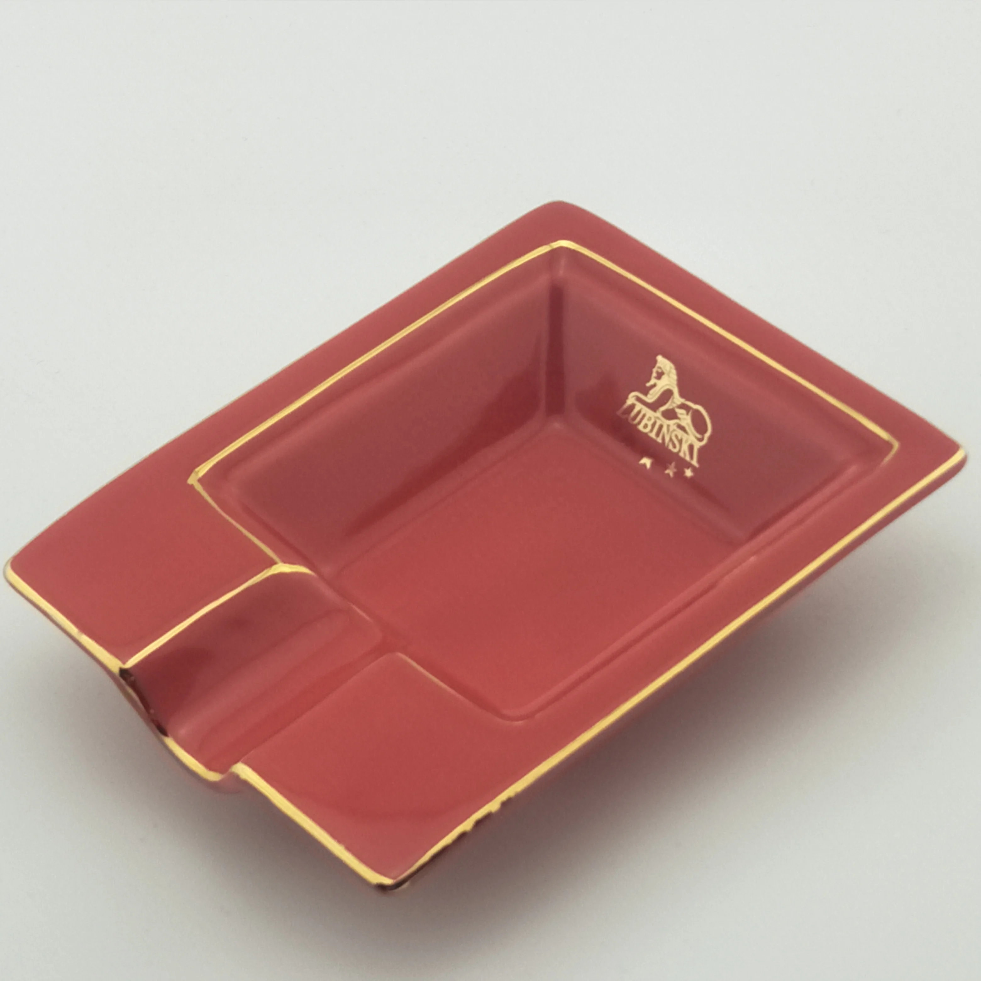 
Best selling black ceramic ashtray with golden edge with one rest with customized logo for sale 