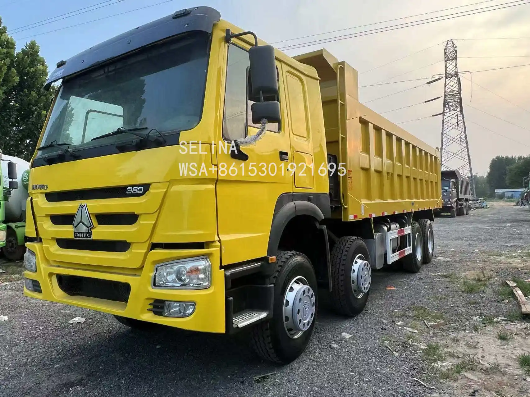 USED HOWO 8X4 DUMP TRUCK WITH EURO 4 EMISSION HYDRAULIC DUMP SYSTEM 380 HP