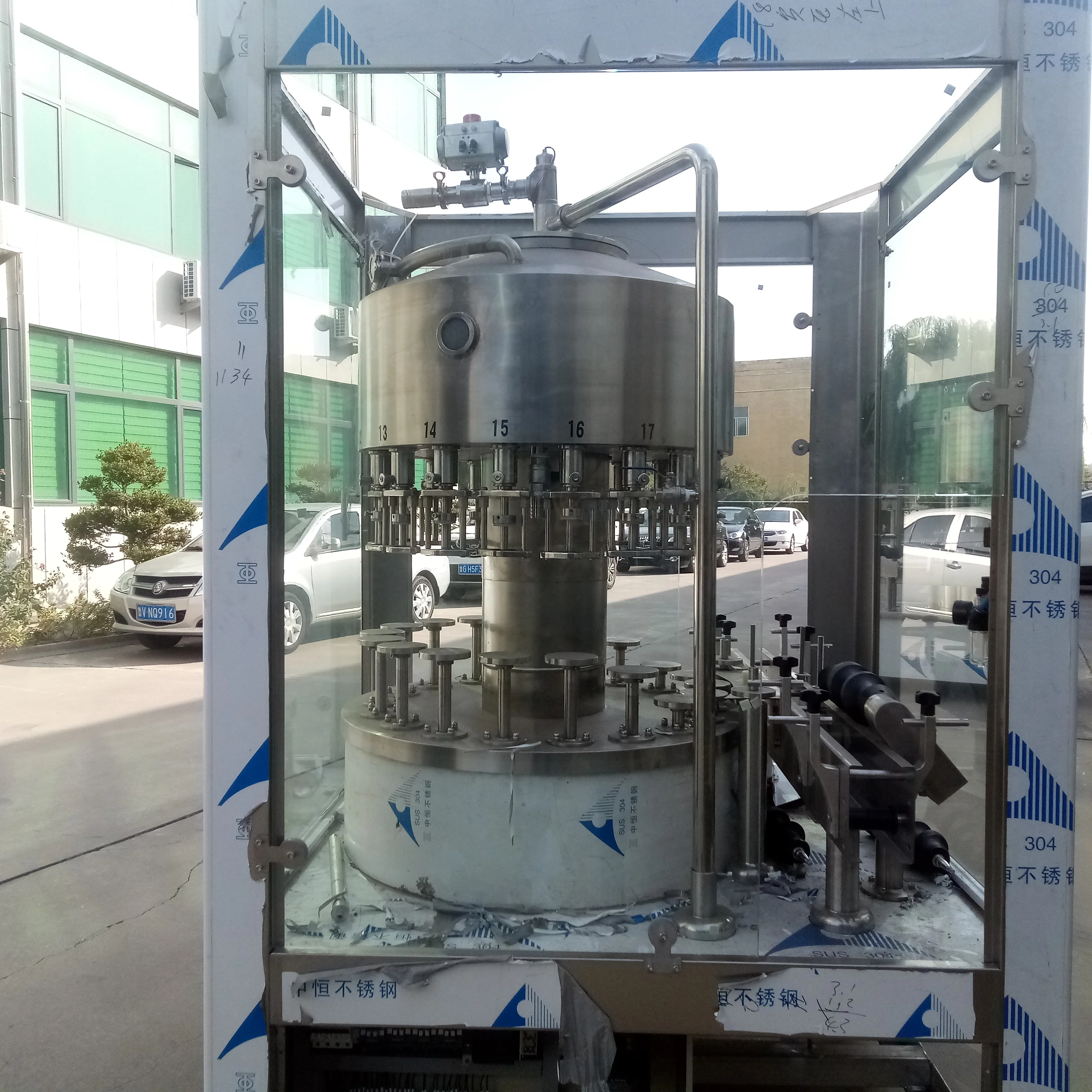 12heads full automatic rotary Acqua panna Evian water glass bottle aluminum lid filling machine