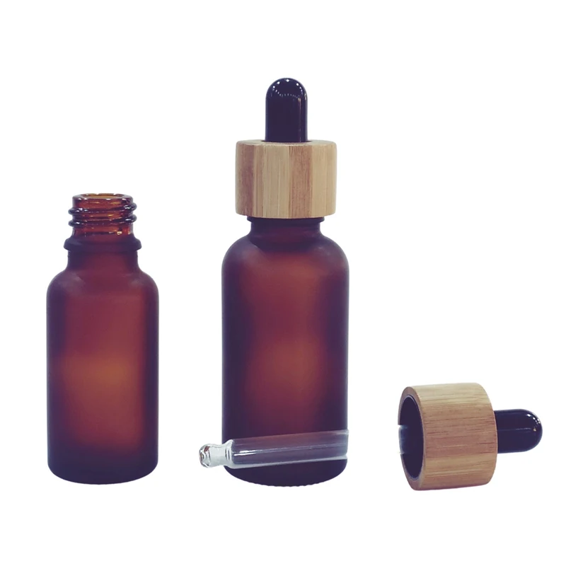 Custom 5ml 10ml 15ml 20ml 30ml 50ml 100ml matte black essential oil serum glass dropper bottle with bamboo cap paper tube