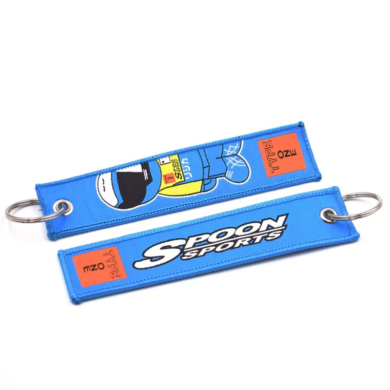 Wholesale customized remove luggage tag label before embroidery keyring flight for logo woven keychains