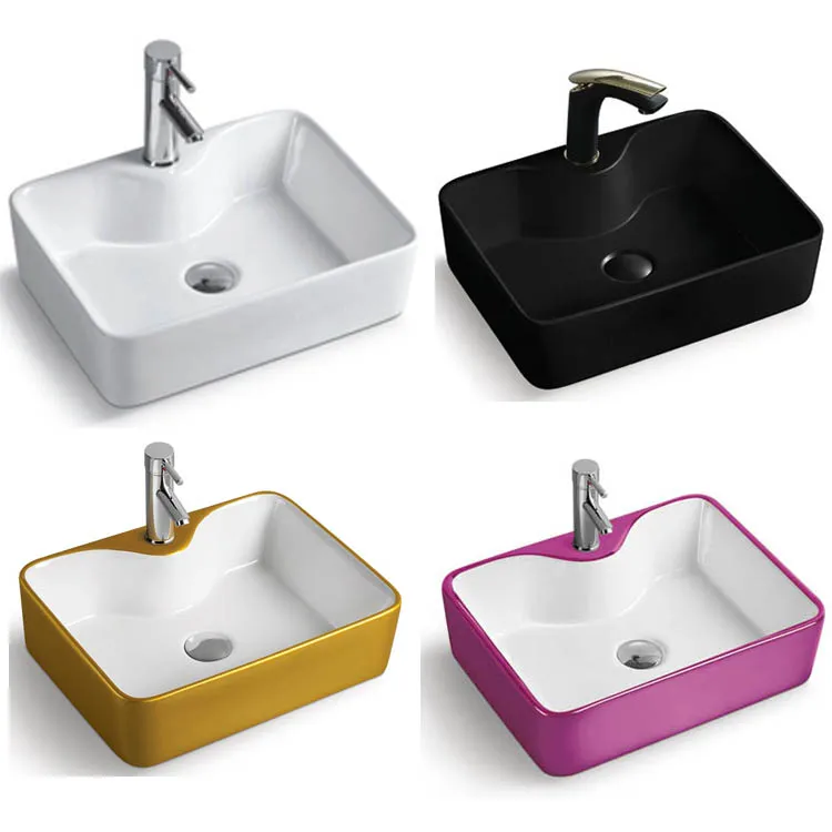 Rectangular recessed bathroom sink White ceramic counter above semi-recessed container sink with extensive faucet hole, drain pi