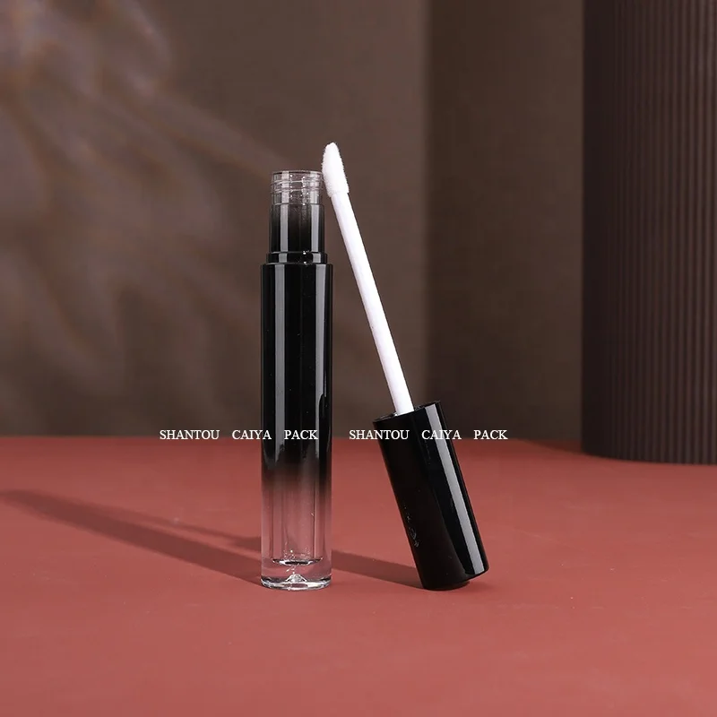 Shantou cosmetic packaging manufacturer wholesale 3ml long neck empty frost black silver round lip gloss balm tube heart brush