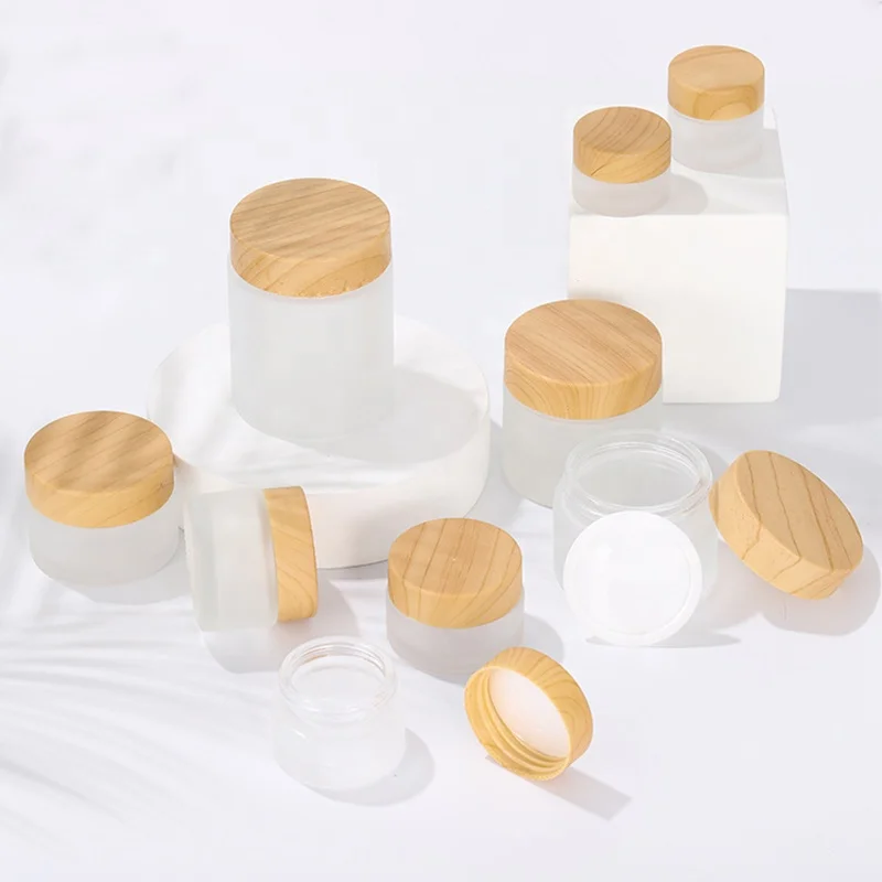 
China suppliers 25g 80g 80ml 50 ml empty frosted glass skincare jar containers cosmetic cream glass jars with bamboo printed lid 