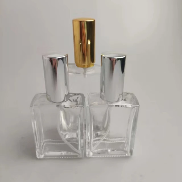 100ml perfume spray bottles cosmetic glass container transparent body and silver lid