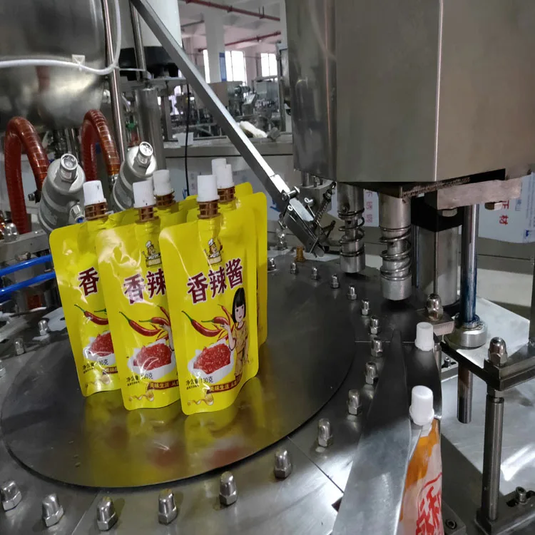 Rotary Automatic Premade Spout Bag Doypack Suck Pouches Filler Drink Milk Filling Capping Machine For Liquid Juice