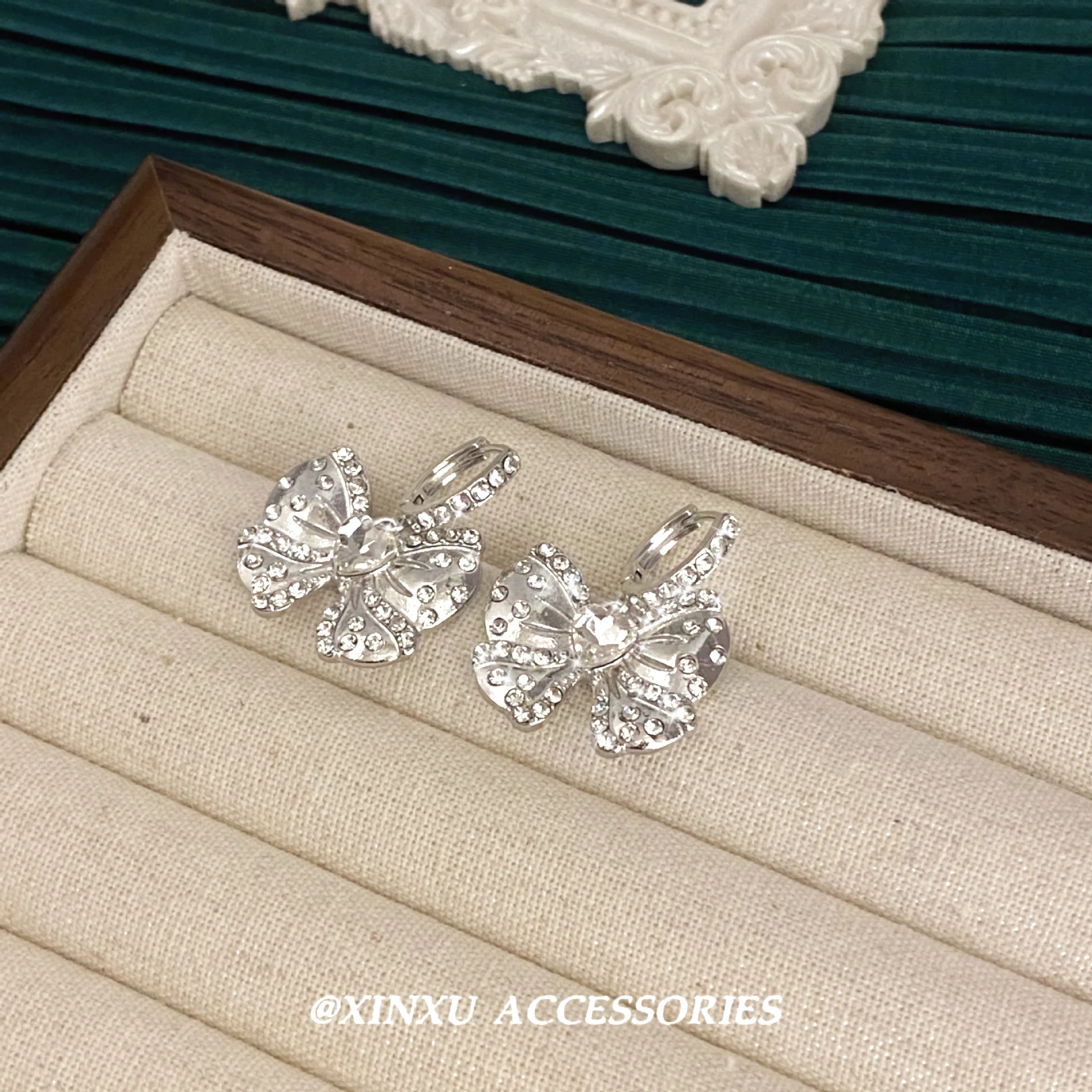 Bow ear female 2024 new fashion summer niche design sense of advanced micro-diamond earrings sweet temperament