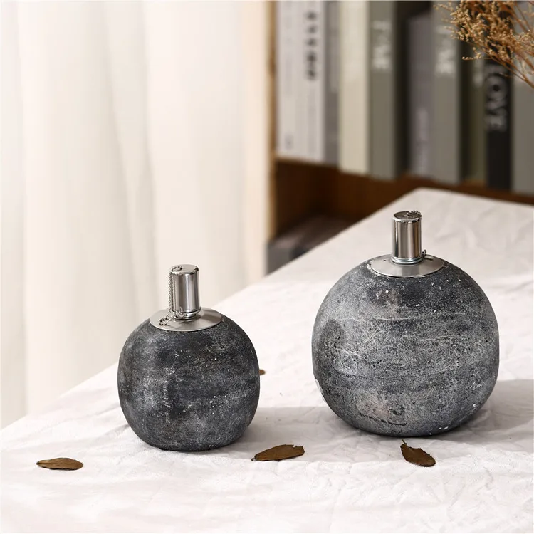 Wholesale custom antique design indoor round ball rough cement oil burner for home decor