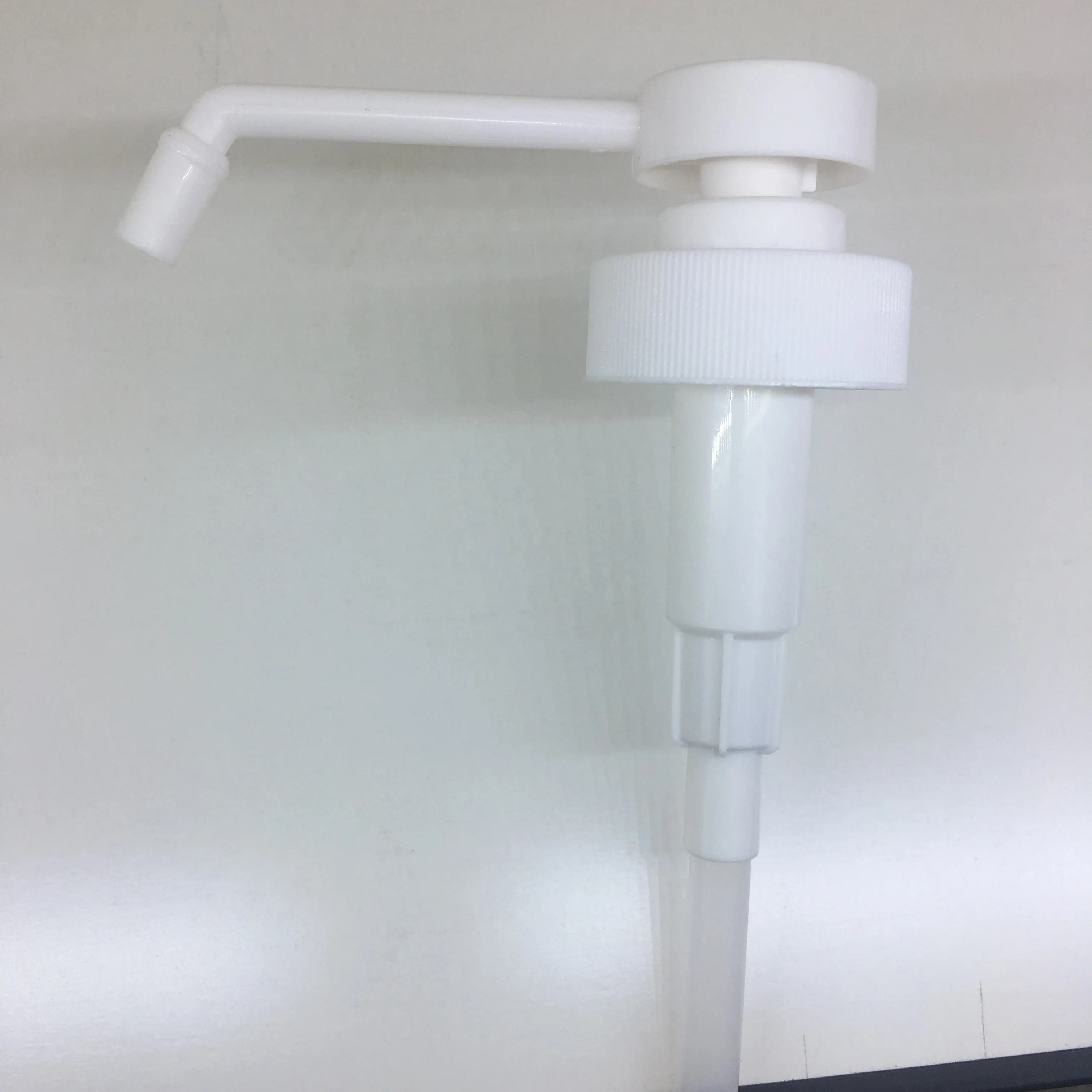 White PP 38-400 sanitizer sprayer dispensing pump with 11 inch dip tube for 1 gallon bottle