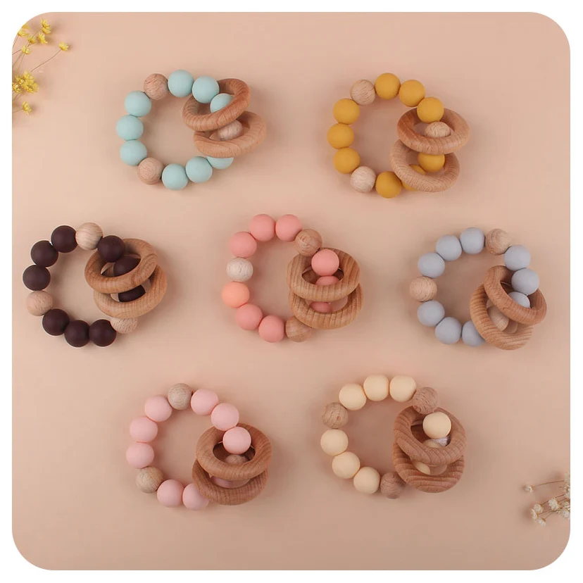 Hot Sell Newborn Silicone Beads Diy Baby Silicone Rattle Wrist Ball Teether Ring Beech Wooden Teething Ring Toys Bebe Gift