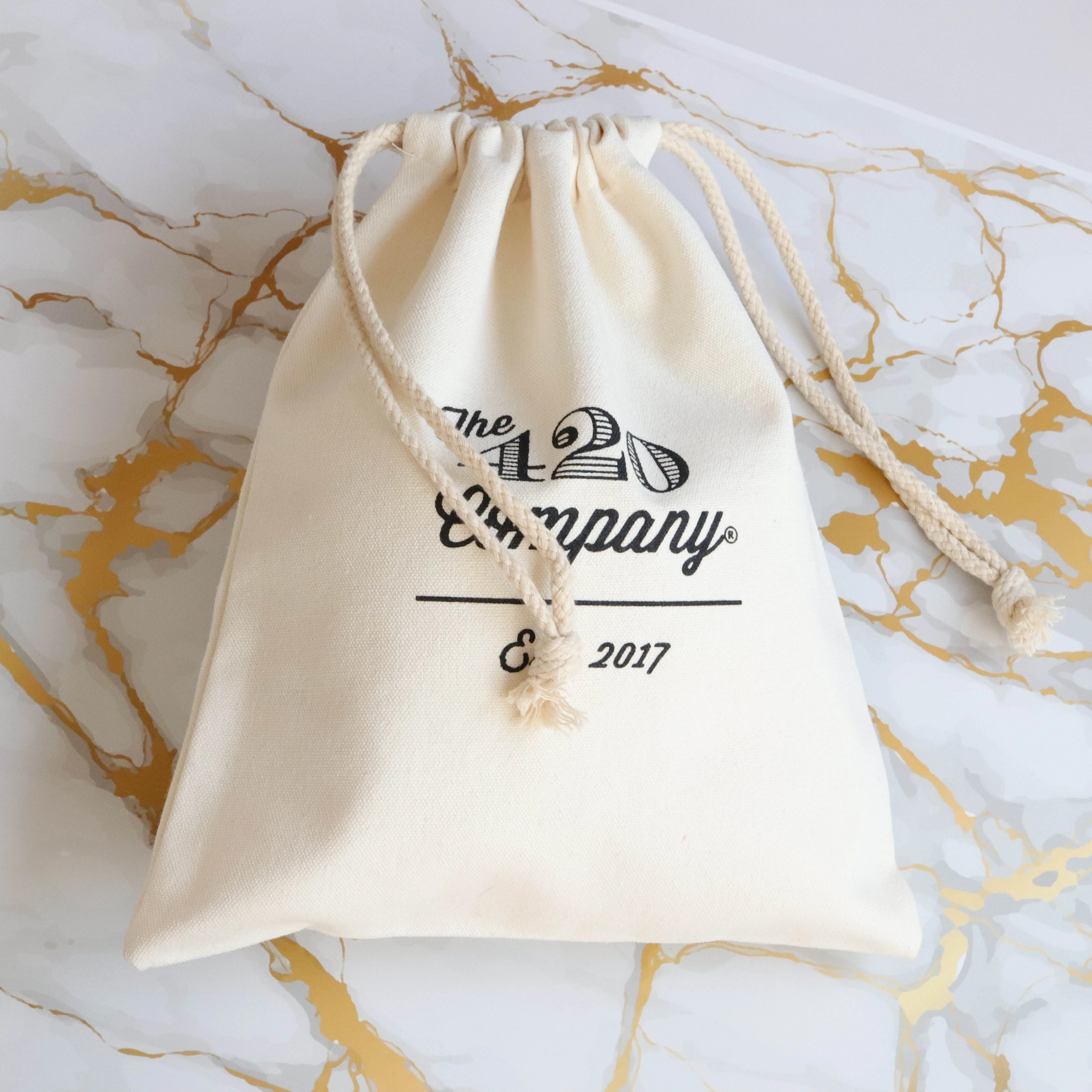 Ecofriendly large natural beige cotton canvas dust pouch with black logo printed hats handbag package drawstring bag