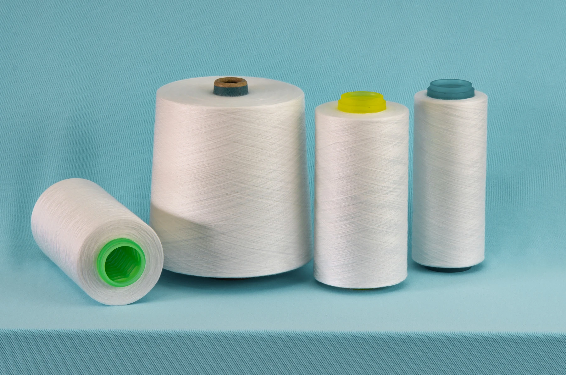 Wholesale high tenacity raw white spun polyester sewing thread 20/2 20/3 TFO for dyeing