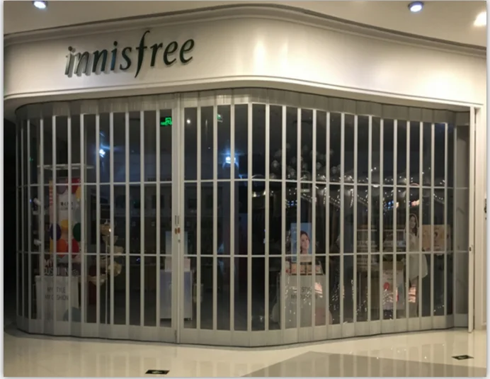 High-end brand cosmetics store door beautiful transparent pvc crystal aluminum alloy reinforced material folding door