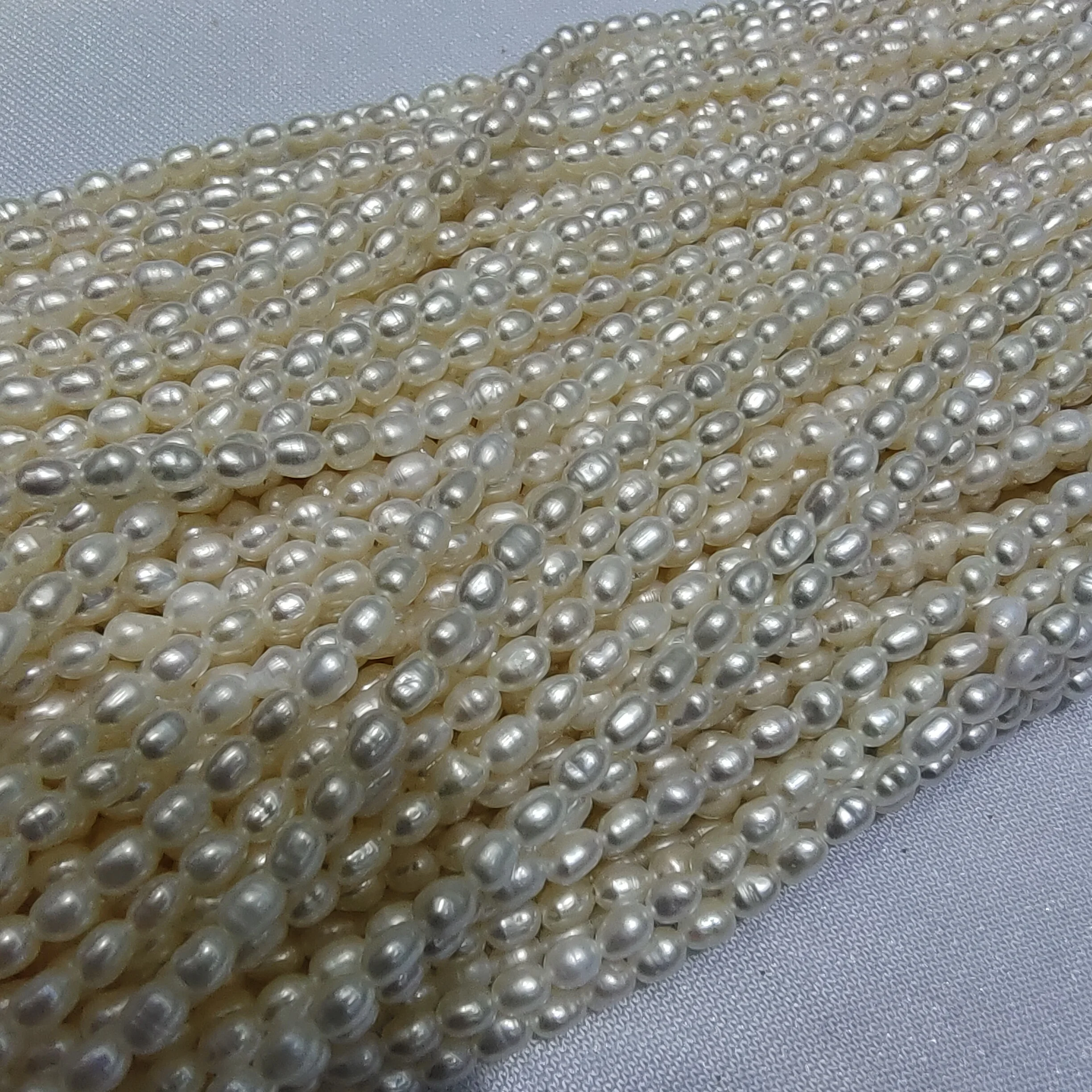 Xygems high quality rice shaped loose natural freshwater pearls beads for jewellery making