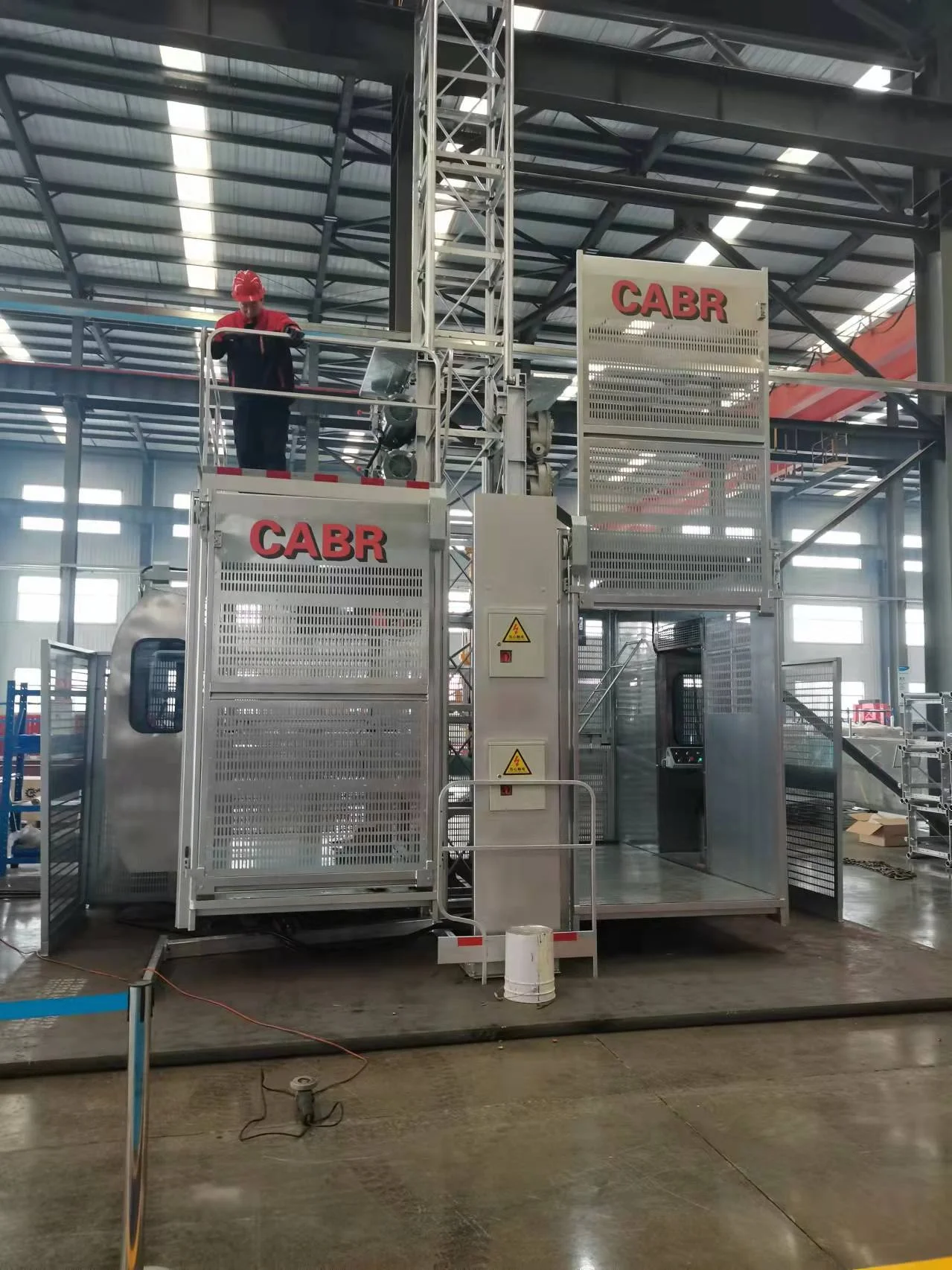 Rack and pinion elevator construction building equipment persons and material construction lifter