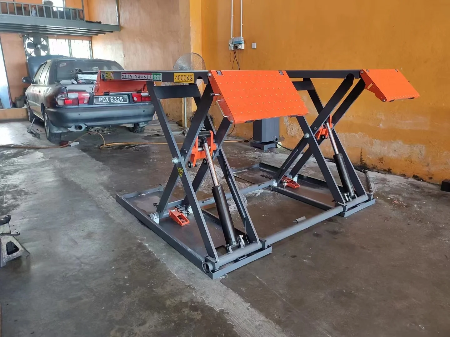 1.2m 4000kg hydraulic motor auto motive scissor car lifting platform sell well