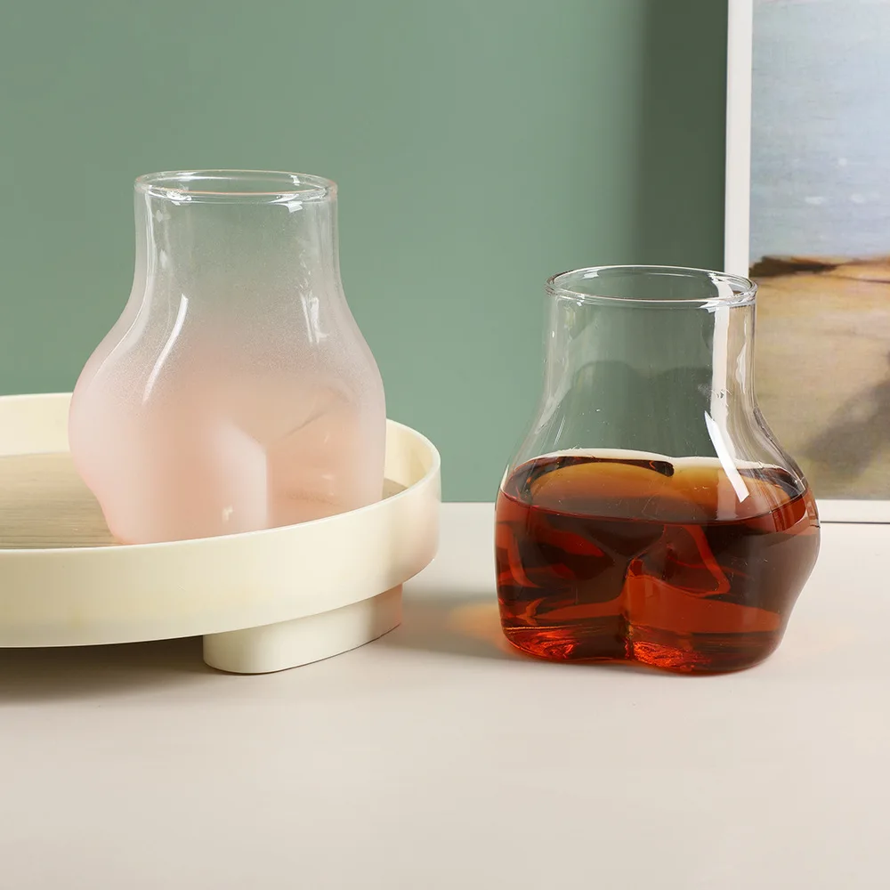 YML factory wholesale Creative personality funny peach butt shape glass  bottle pink frosted butt cup ins coffee drink cup