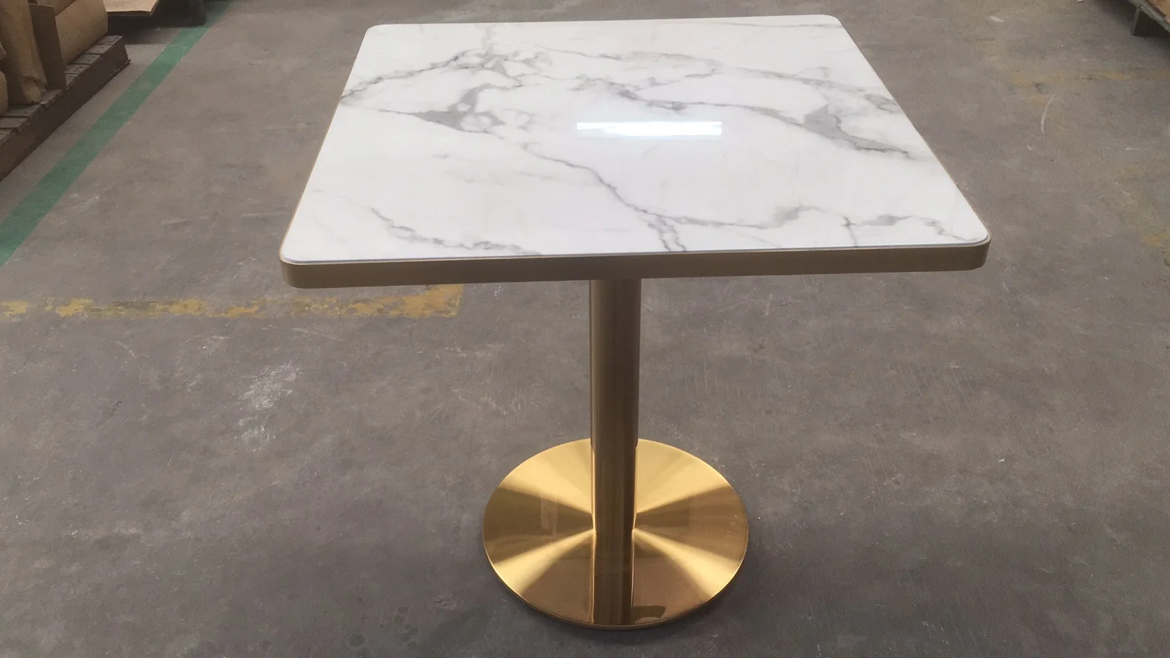golden SS leg stone table.jpg