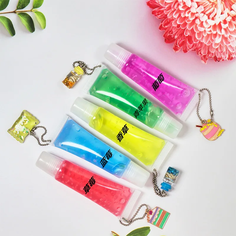 Logo free lip gloss keychain fruit flavor fading lip lines rainbow moisturizing lip gloss