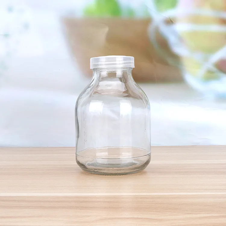 Hot selling 650ml orchids glass tissue culture bottle with breath hole lid wholesale