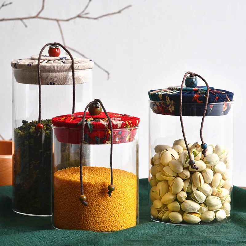 High quality fast delivery heat-resistant glass tea cabs candy storage jar food grade container borosilicate jars cloth cover