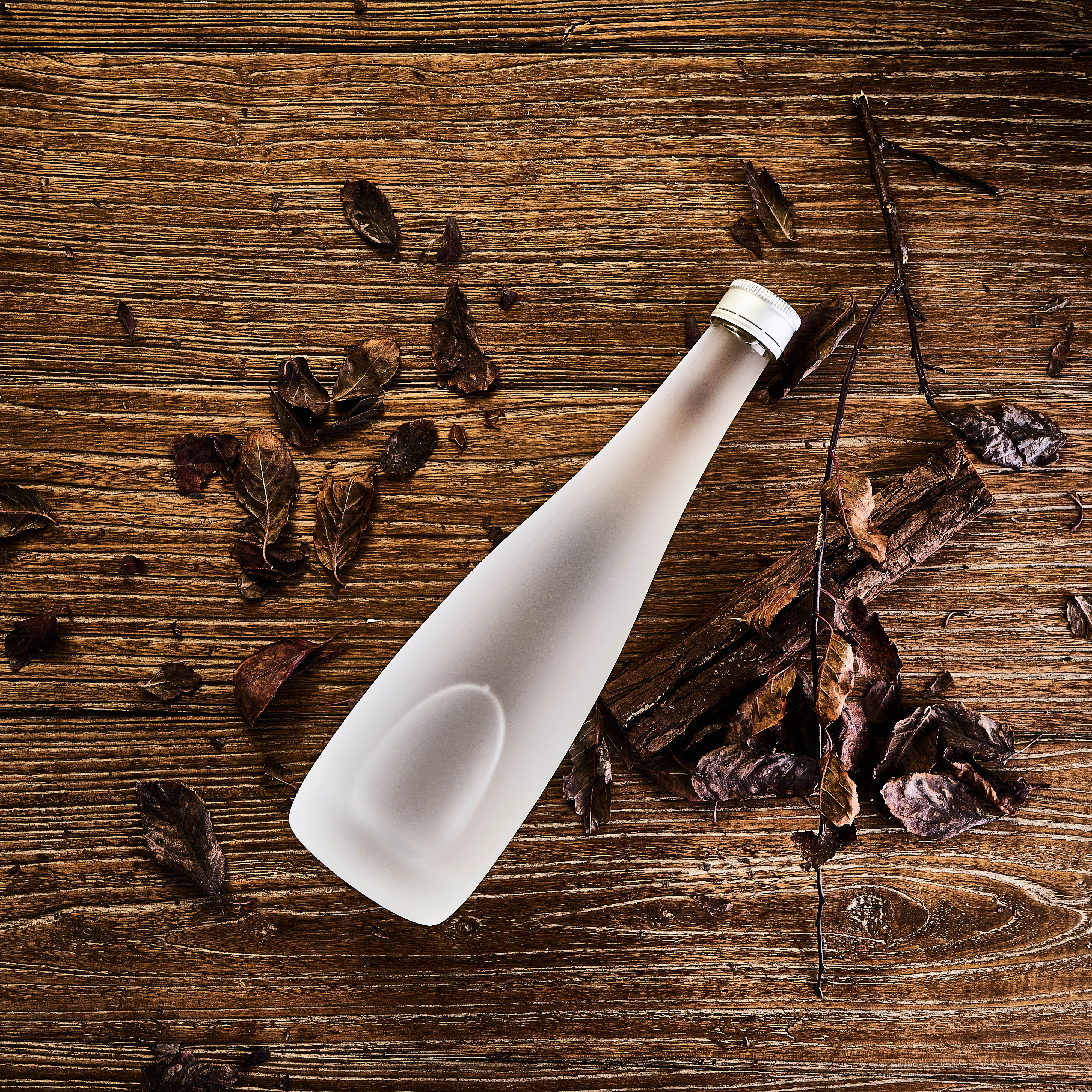 Custom Design 500ml 750ml Frosted Clear Round Shape High White Glass Material Liquor Wine Bottle With Wooden Cork