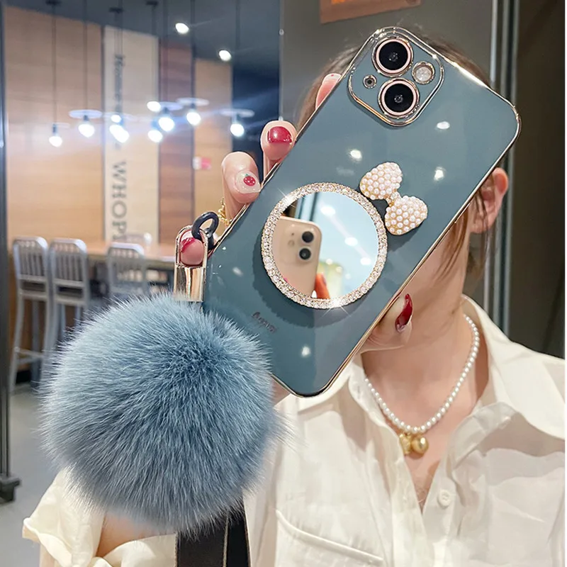 Fashion Luxury Bow Rhinestones Mirror Back Cover Plating TPU Fur Ball hand strap Girls Phone Case for iPhone 13 12 Pro Max