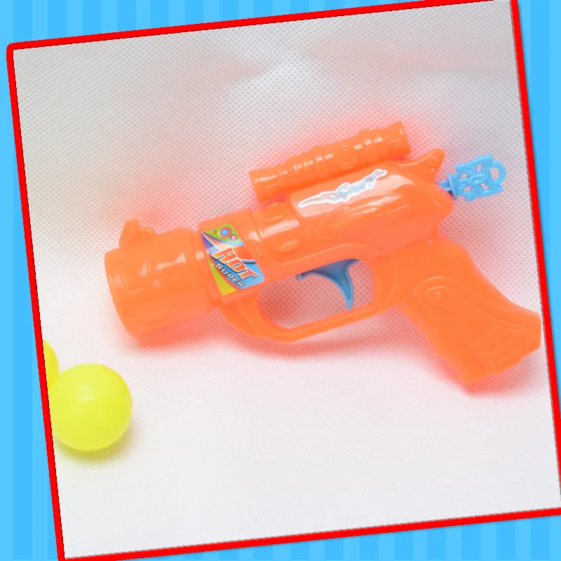 2022 cheap toy of plastic gun toy with candy best selling in supermarket shooting pingpong gun orange green color