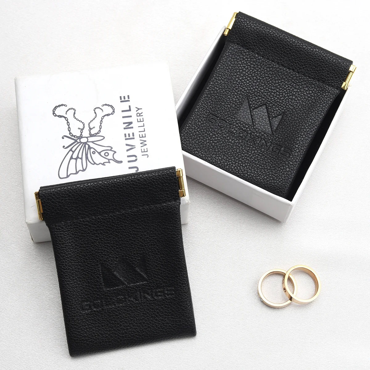 Custom Emboss Logo Reusable PU Leather Black Bag For Bluetooth Headset Packaging Shrapnel Openings Leather Dust Pouch