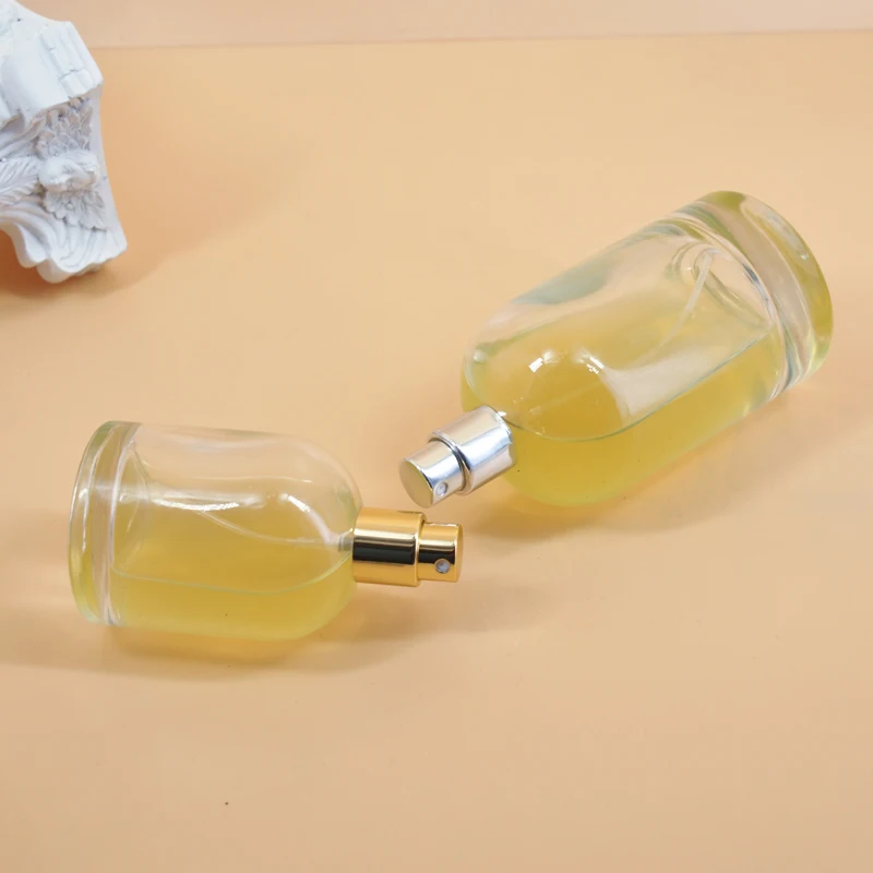 Customized logo 30ml  50ml 100ml round shape perfume glass bottle  Mist Spray Pump Glass Perfume Bottle with Silver Golden Caps