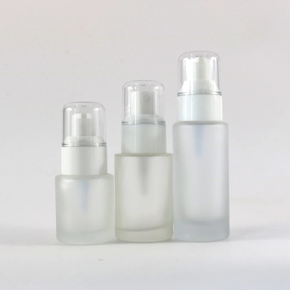 Cosmetic clear frosted glass flat shoulder bottle with white white pump